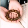 Natural golden silk sandalwood men's and women's hand string beads for Buddhist chanting and fingering, a cultural plaything with sandalwood fragrance, and also a hand accessory for gifts.
