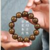 Natural golden silk sandalwood men's and women's hand string beads for Buddhist chanting and fingering, a cultural plaything with sandalwood fragrance, and also a hand accessory for gifts.