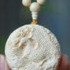 Hand - carved Double - sided Mammoth Ivory Pendant with Dragon and Phoenix Patterns. It can be used as a hanging ornament, a necklace pendant, a Buddhist bead pendant, or a trendy sweater chain.