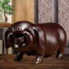 Pear wood carving of the pig, redwood and ebony wood carvings of the pig among the twelve Chinese zodiac animals for attracting wealth. They are tabletop birthday gifts, the lucky golden pig ornaments.