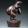 Ebony wood carving rat ornaments, the rat among the twelve Chinese zodiac animals for attracting wealth. They are home decorations for the living room and handicraft gifts made of mahogany.