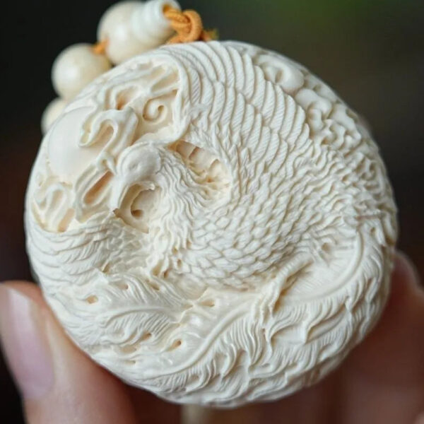 Hand - carved Double - sided Mammoth Ivory Pendant with Dragon and Phoenix Patterns. It can be used as a hanging ornament, a necklace pendant, a Buddhist bead pendant, or a trendy sweater chain.