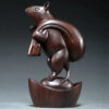 Ebony wood carving rat ornaments, the rat among the twelve Chinese zodiac animals for attracting wealth. They are home decorations for the living room and handicraft gifts made of mahogany.