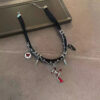 AVA's original irregular cross - shaped dark - colored rivet multi - layer winding necklace. It features a niche design and belongs to the sub - cultural Y2K