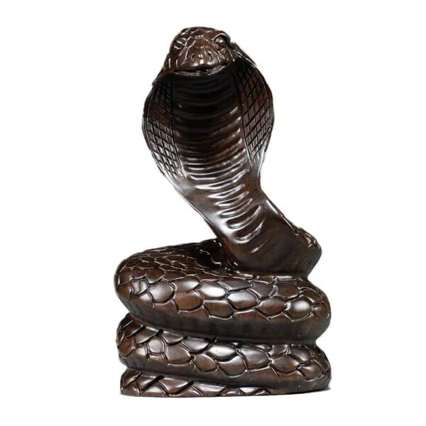 Solid ebony wood carving of the snake among the twelve Chinese zodiac animals (cobra) ornaments. They can attract wealth and are used for home and office decoration as well as feng shui purposes. They are handicraft items made of mahogany.