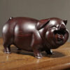 Pear wood carving of the pig, redwood and ebony wood carvings of the pig among the twelve Chinese zodiac animals for attracting wealth. They are tabletop birthday gifts, the lucky golden pig ornaments.