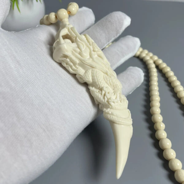 Mammoth Ivory - carved Dragon Tooth Pendants, made from mammoth tusk tips. These