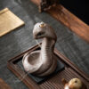 e2e0569b-88d1-4648-8732-5bca8cc23a85.jpg Reverse incense burner, creative ceramic Chinese zodiac snake ornament for incense ceremony with old clay and spirit snake design, suitable for household use with sandalwood and agarwood incense