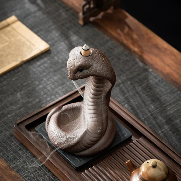 e2e0569b-88d1-4648-8732-5bca8cc23a85.jpg Reverse incense burner, creative ceramic Chinese zodiac snake ornament for incense ceremony with old clay and spirit snake design, suitable for household use with sandalwood and agarwood incense