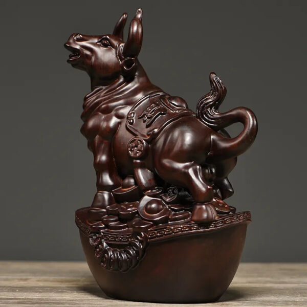 Solid ebony wood carving of the twelve Chinese zodiac animals, solid wood ox ornaments. It is a modern handicraft gift for home decoration in the living room or for office use.