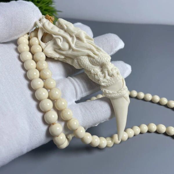 Mammoth Ivory - carved Dragon Tooth Pendants, made from mammoth tusk tips. These